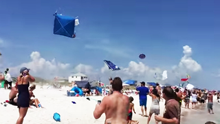 Blue Angel #5's Near-Supersonic Sneak Pass Sent Beach Umbrellas Flying